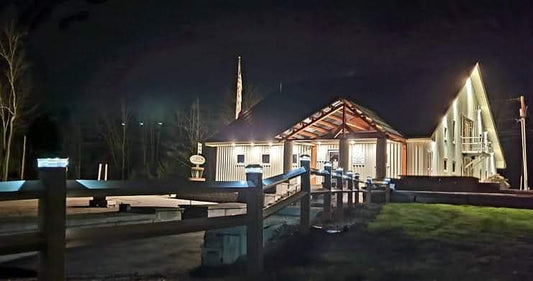 the sabattus disc golf pro shop lit up at night for winter night disc golf.