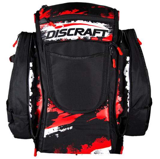 Black backpack with red and white splatter design and Discraft logo on a white background