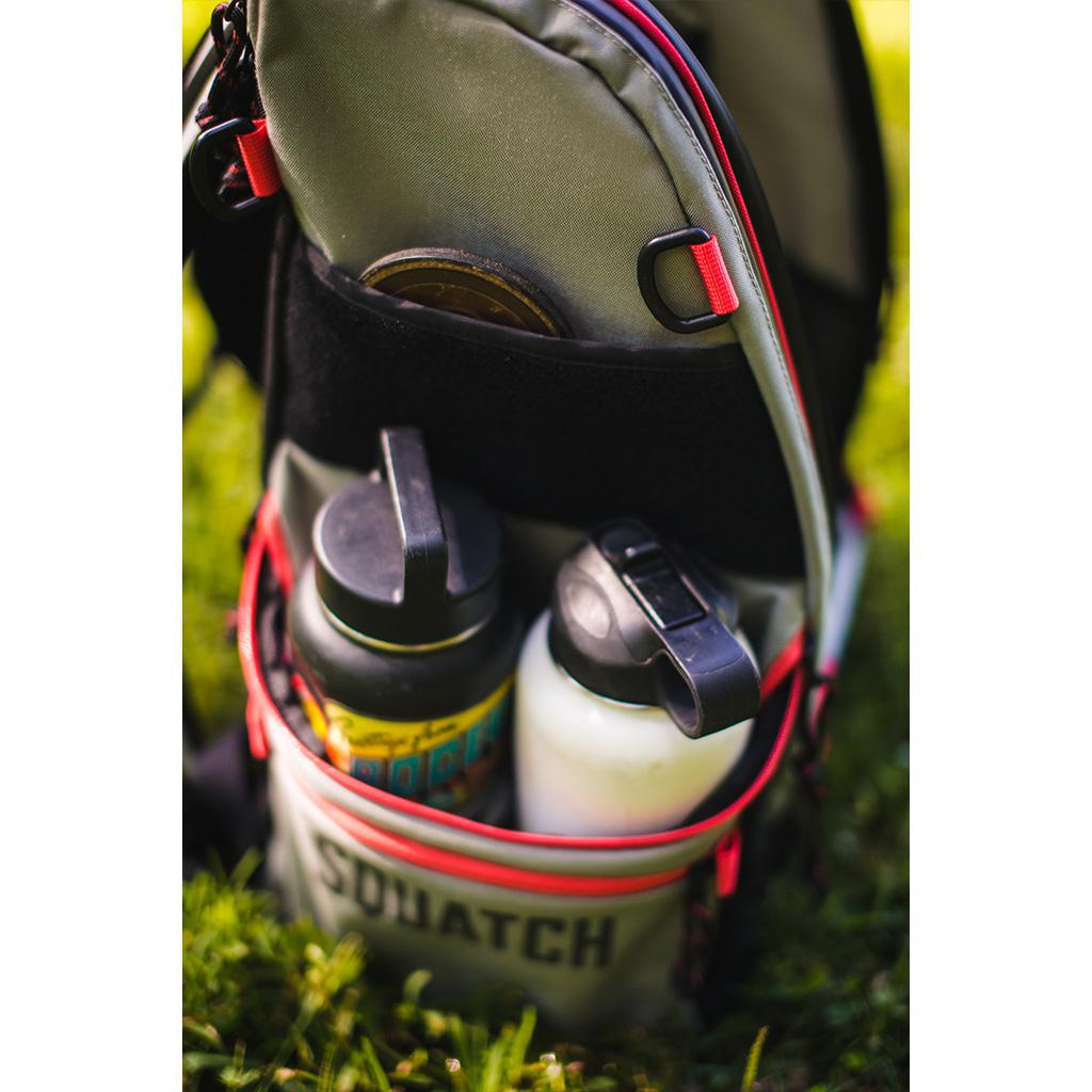 Squatch Ezra Link Backpack w/ Cooler Disc Golf Bag side pocket with a mini marker and pocket holding 2 canteens