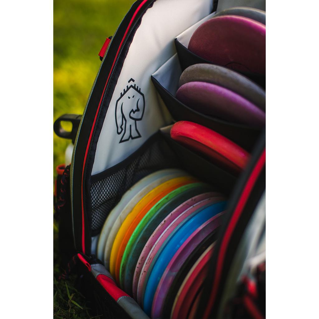 Squatch Ezra Link Backpack w/ Cooler Disc Golf Bag inside side view with Squatch logo and loaded with discs
