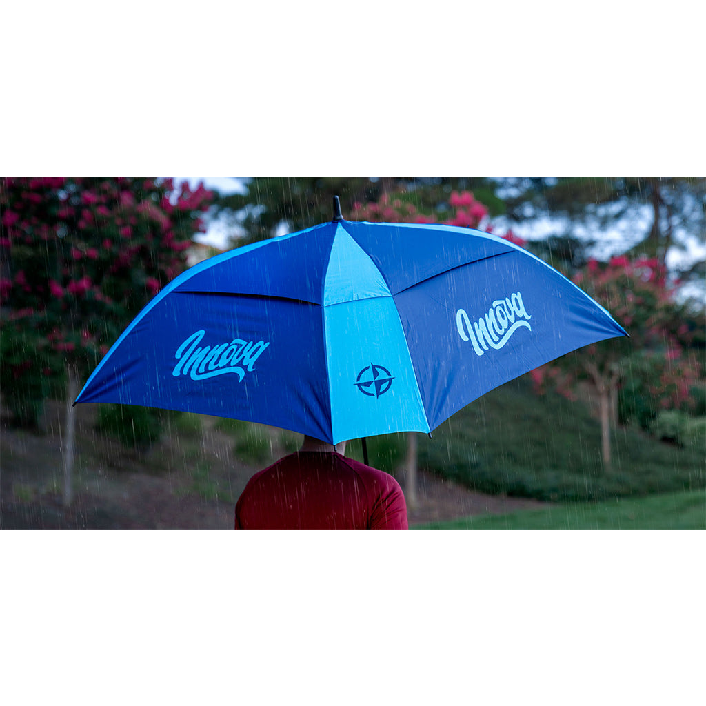 Innova Flow Umbrella Disc Golf Accessories Blue-Aqua Being used in the rain