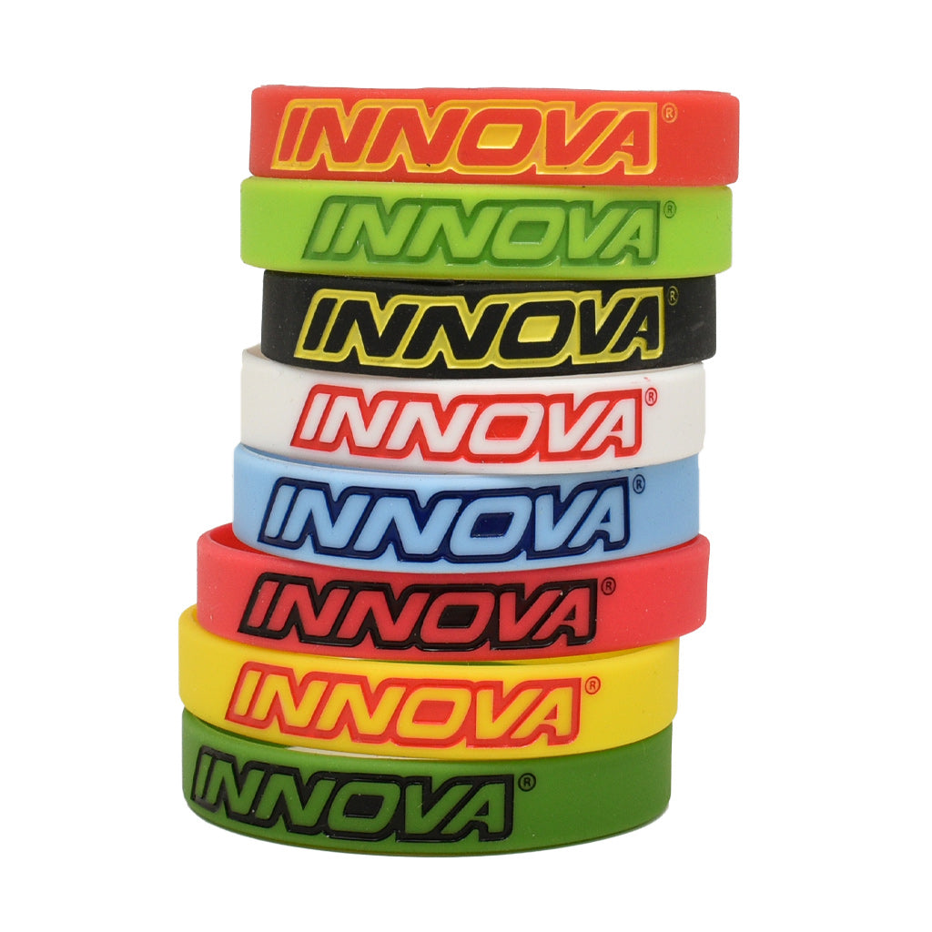Innova Silicone Wrist Bands front view stack in order Red/Yellow, Lime Green, Black/Yellow, White/Red, Light Blue, Red/Black, Yellow Red, Kelly Green 