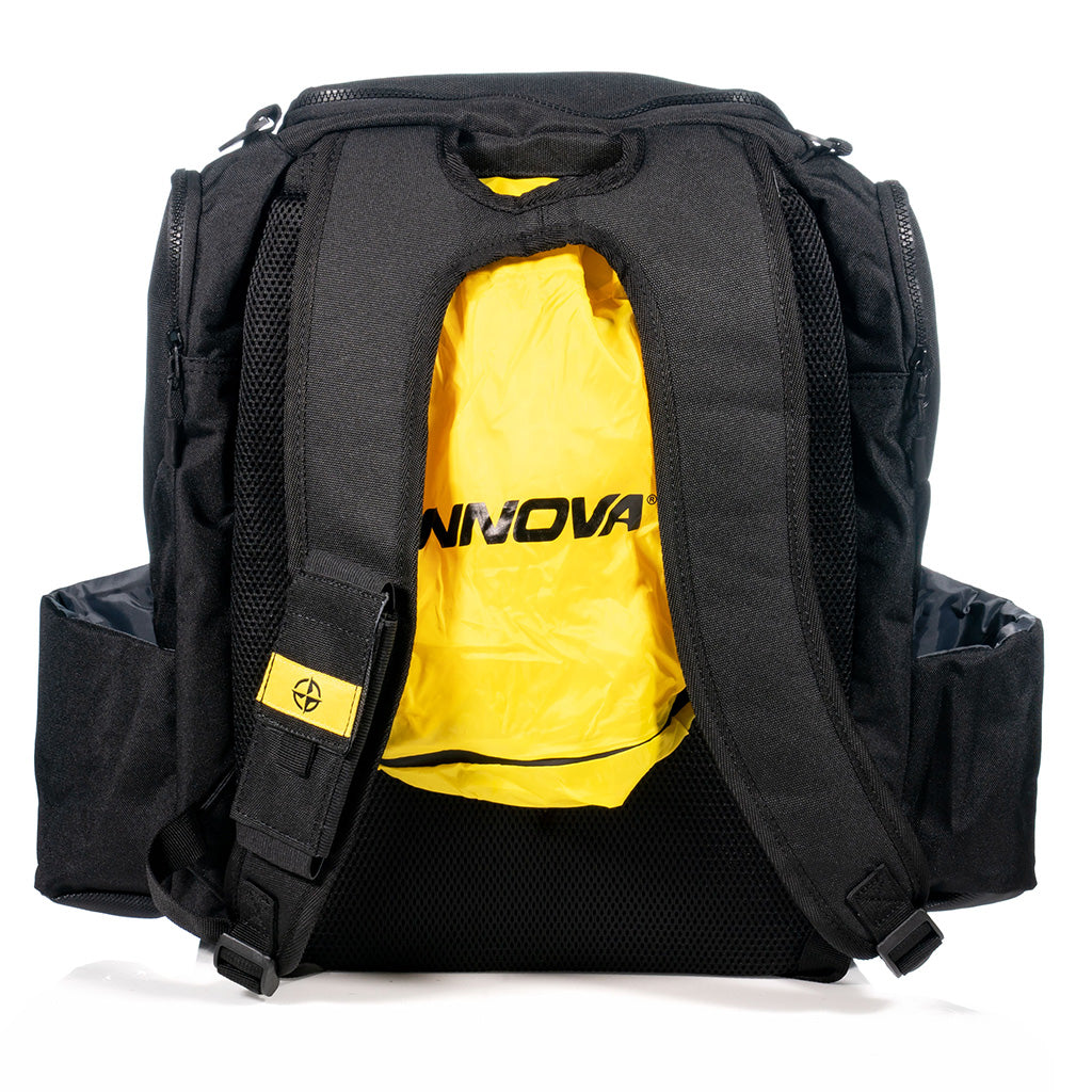 Innova Safari Pack Backpack Disc Golf Bag black back view showing yellow rain fly that is included