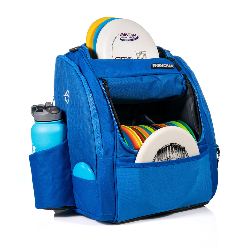 Innova Safari Pack Backpack Disc Golf Bags blue filled with an assortment of discs, mini marker & canteen
